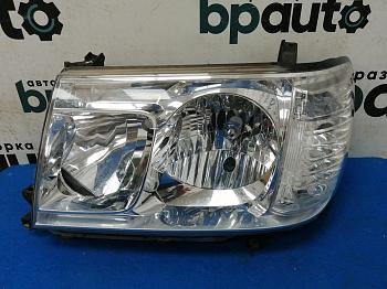 Фара галоген левая 81170-60A70 для Toyota Land Cruiser 100 рест. 2 2005-2007 БУ; Оригинал; Р1, Мелкий дефект;